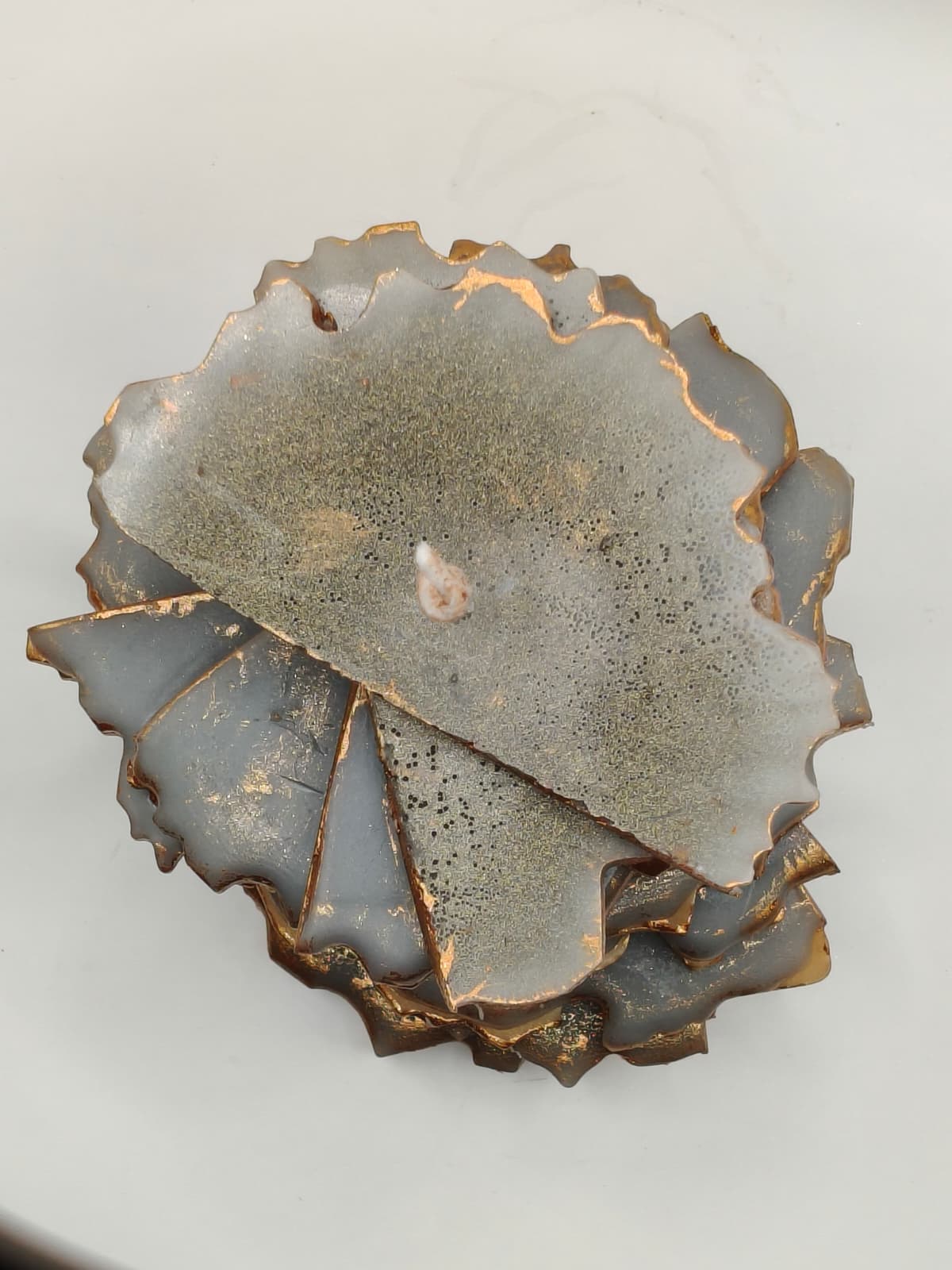 Kintsugi Tower candle top view – handcrafted brown and gold beeswax