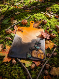 Salem Board pumpkin resin art on moss among autumn leaves and acorns