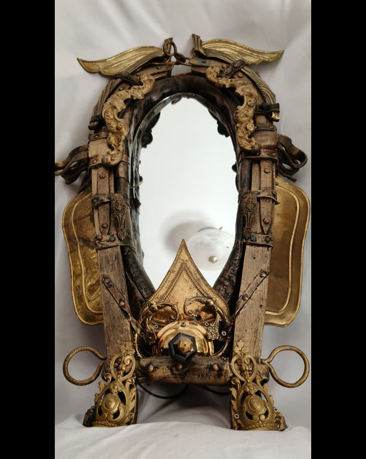 Transylvanian Ride mirror — ornate horse harness frame with cast metal mounts, studio shot on white background