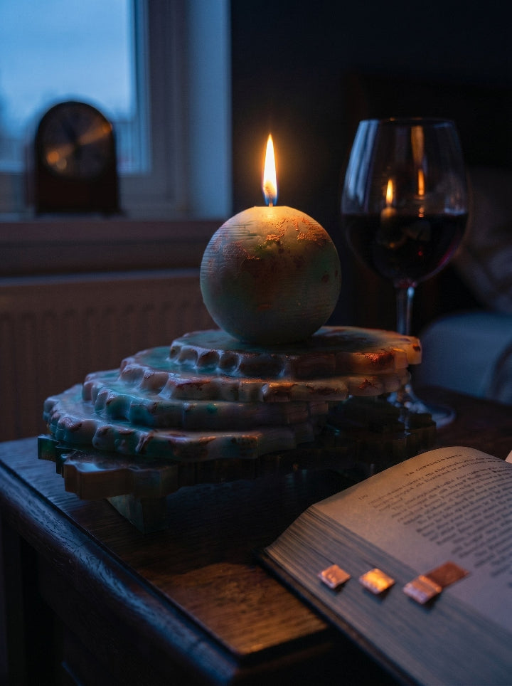 "GAIA" candle on resin stand – lifestyle shot, premium gift packaging